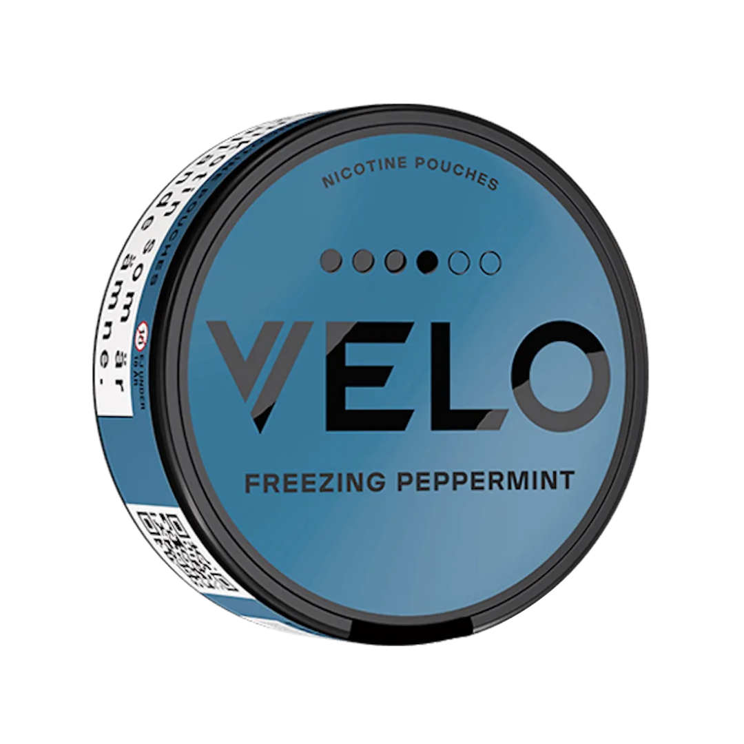 Detail close-up of the Velo Freezing Peppermint snus can featuring cooling peppermint, in blue, black, and white colors.