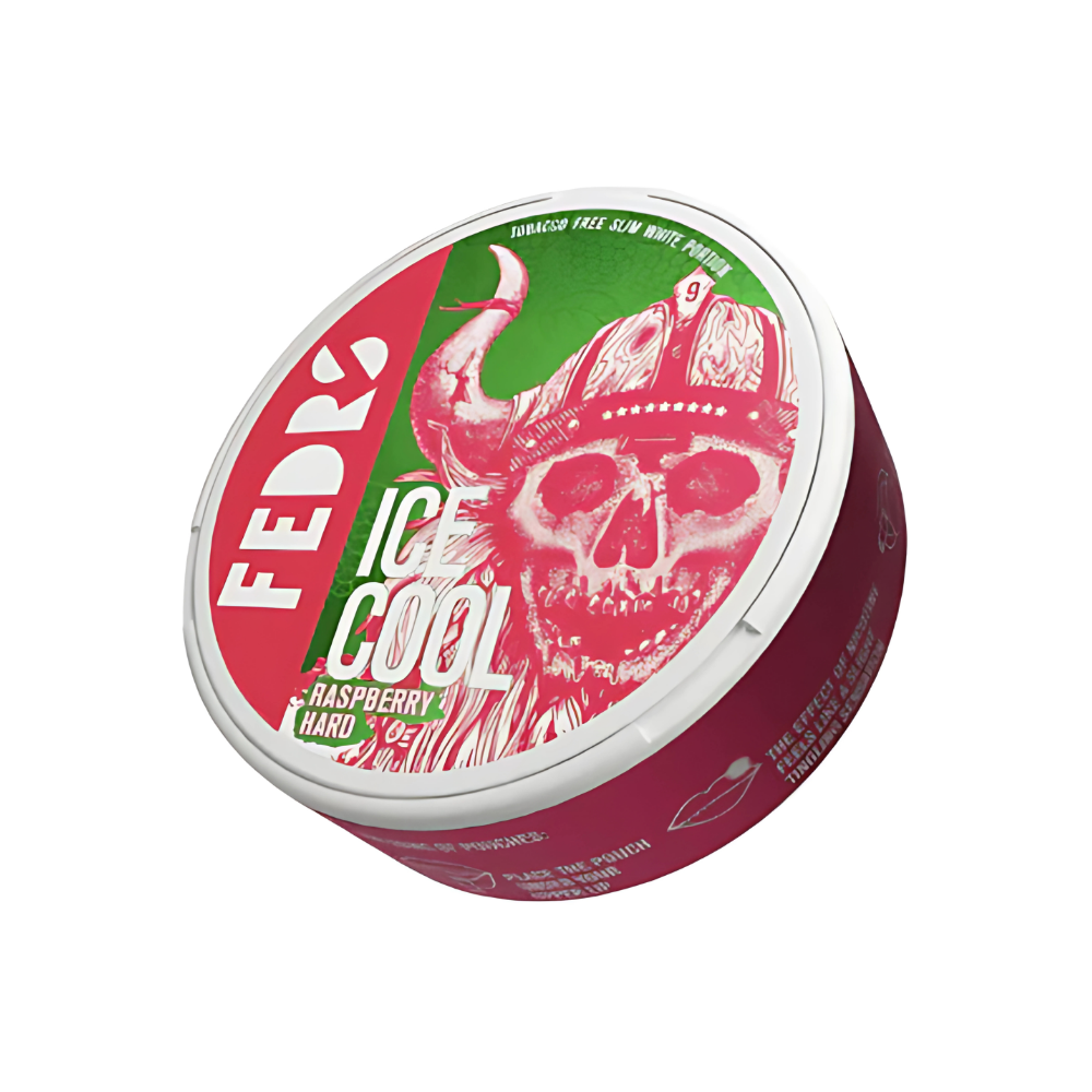 Detail close-up of the raspberry-flavored snus can featuring a green, pink, and white skull design.