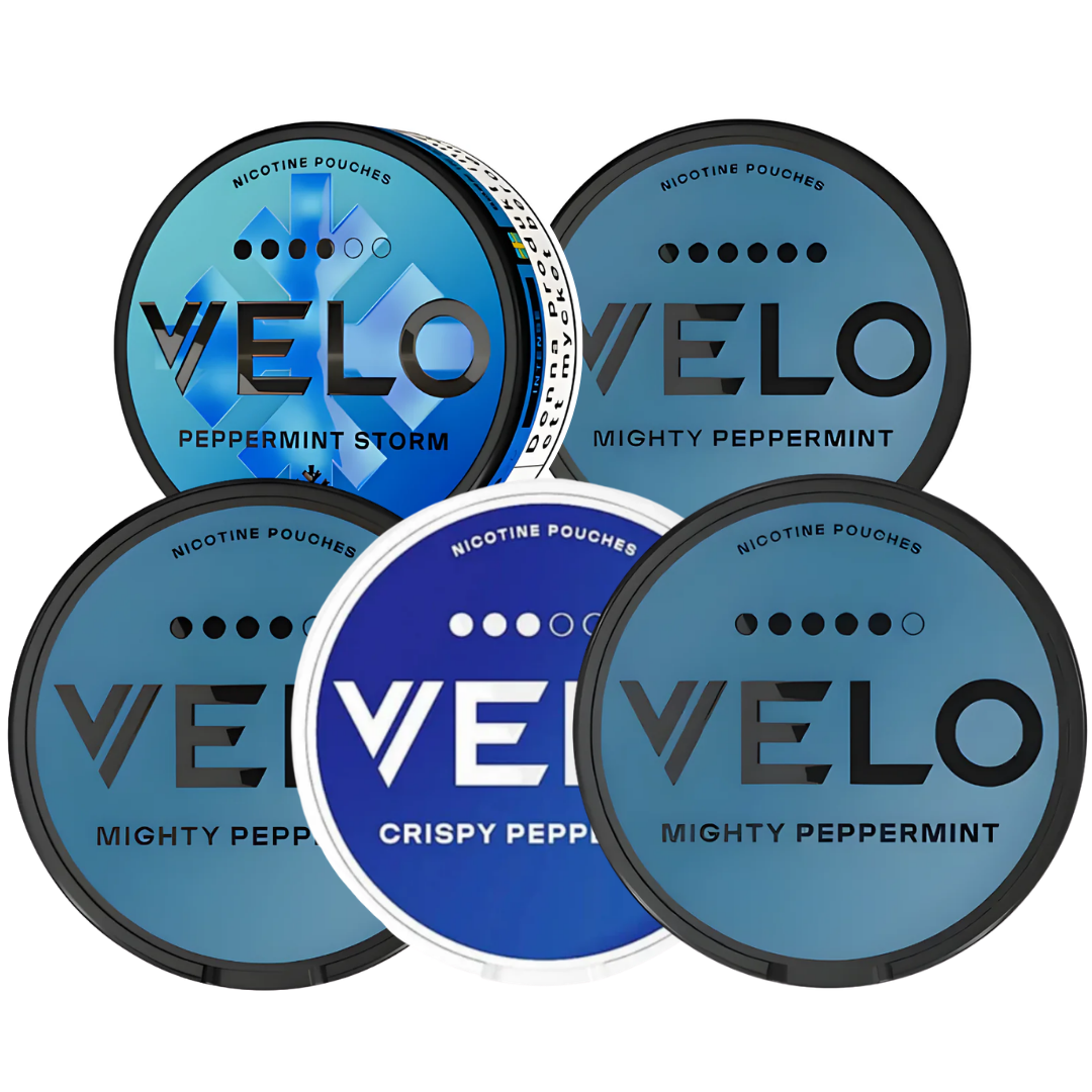 Variety pack of VELO snus cans in blue, black, and white on a transparent background