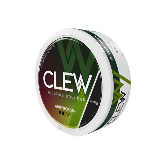 Detail close-up of the Clew container in white, green, and black featuring a round shape and screw top