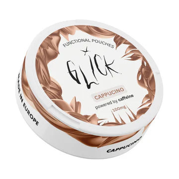 Detail close-up of Glick cappuccino product in a round container with a decorative lid, featuring brown and white colors.