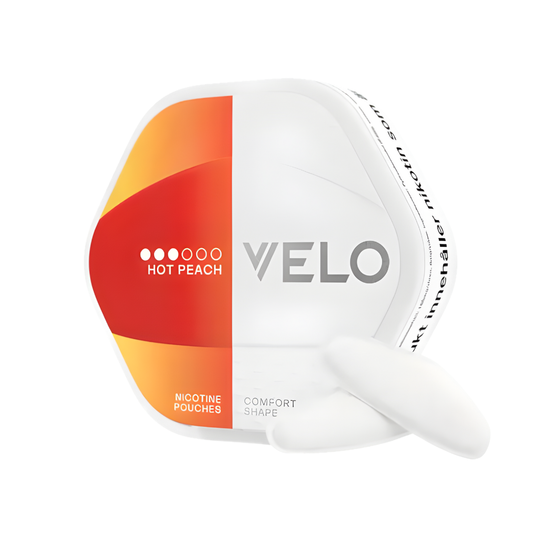 Packaging of VELO Shift Hot Peach nicotine pouches in a hexagonal can, featuring orange and red colors with two white pouc…