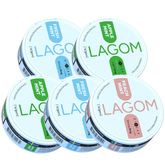 Front view of the Lagom Mixpack featuring round jars in white, green, pink, and blue on a transparent background