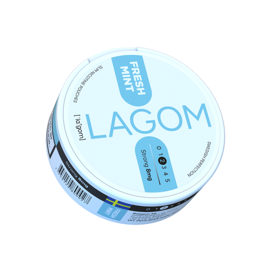 Detail close-up of Lagom Fresh Mint nicotine pouch in a round container, featuring a blue label on a white background.