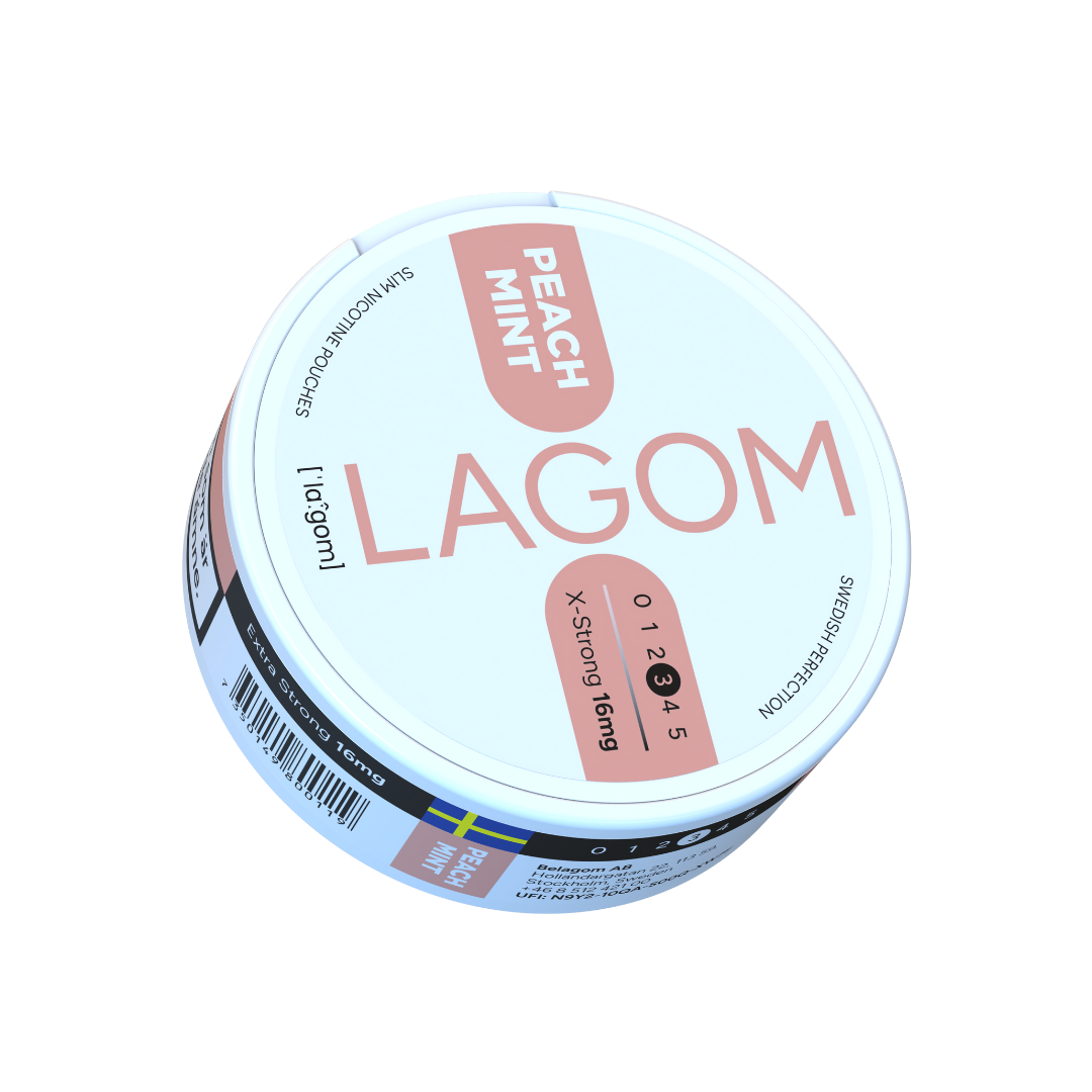 Detail close-up of the round light blue and pink Lagom product container with label text.