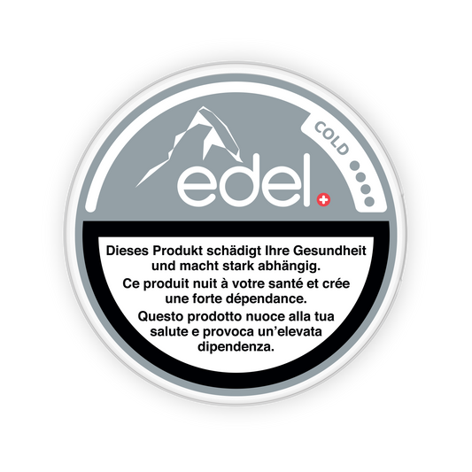 Detail close-up of the black and white Edel Cold snus can featuring a mountain logo and text information.